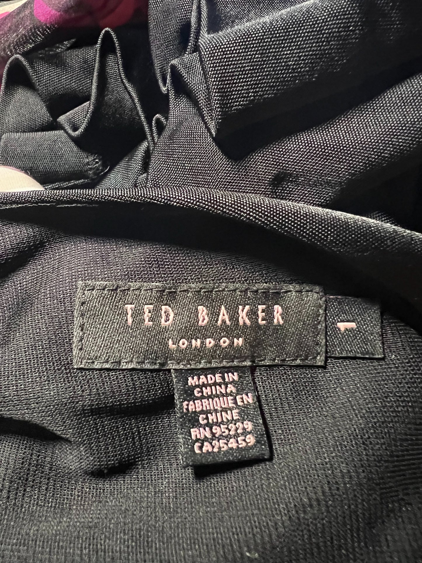 Ted Baker London label on a garment with visible text and design details.