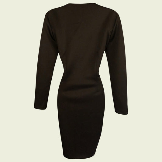 Black dress shown from the back on a beige background