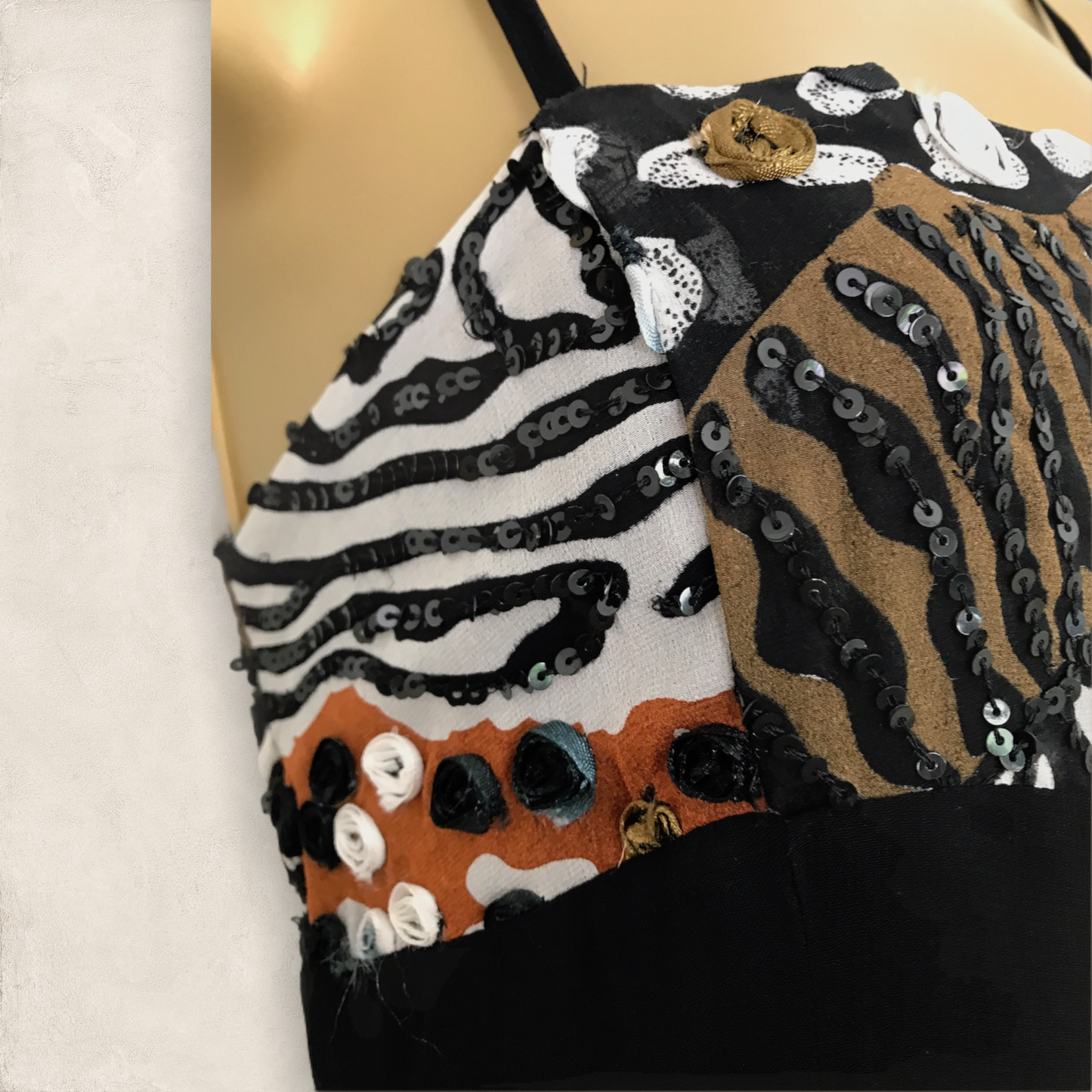 Sequined top with zebra and tiger pattern on a mannequin