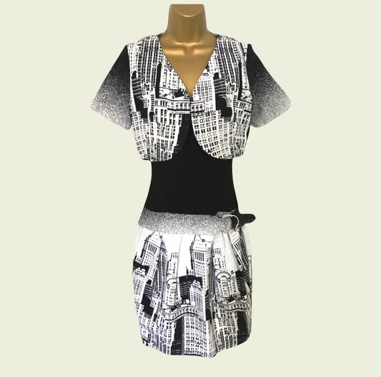 Mannequin wearing a black and white patterned outfit on a beige background