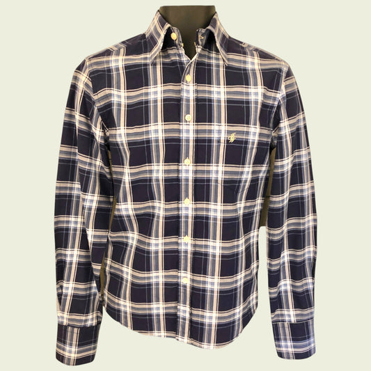 Navy and beige plaid shirt on a light beige background