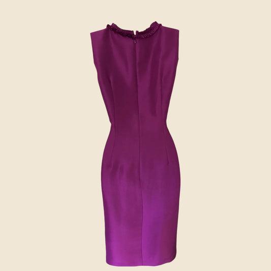 Purple dress on a beige background