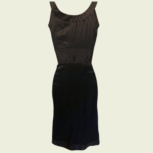 Black dress on a beige background