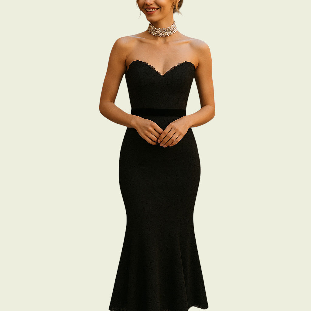 Woman wearing a black strapless gown on a beige background