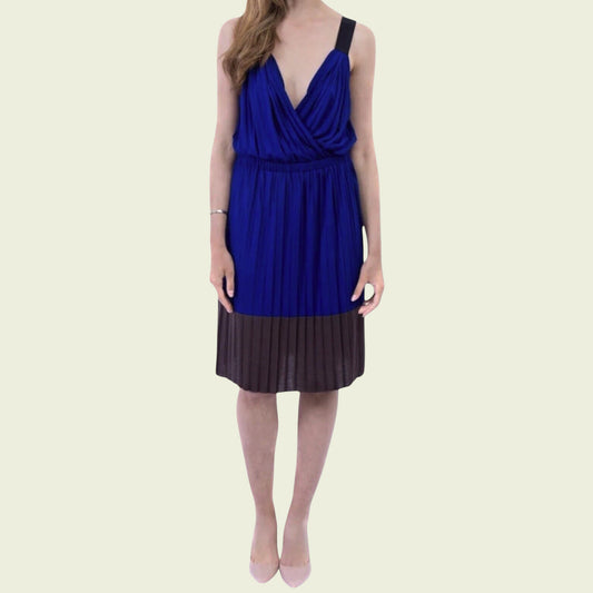 Woman wearing a blue dress on a beige background