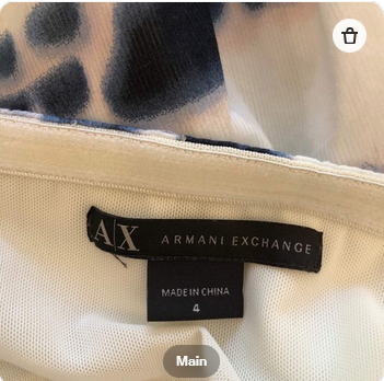 Armani Exchange label on a garment with a patterned background