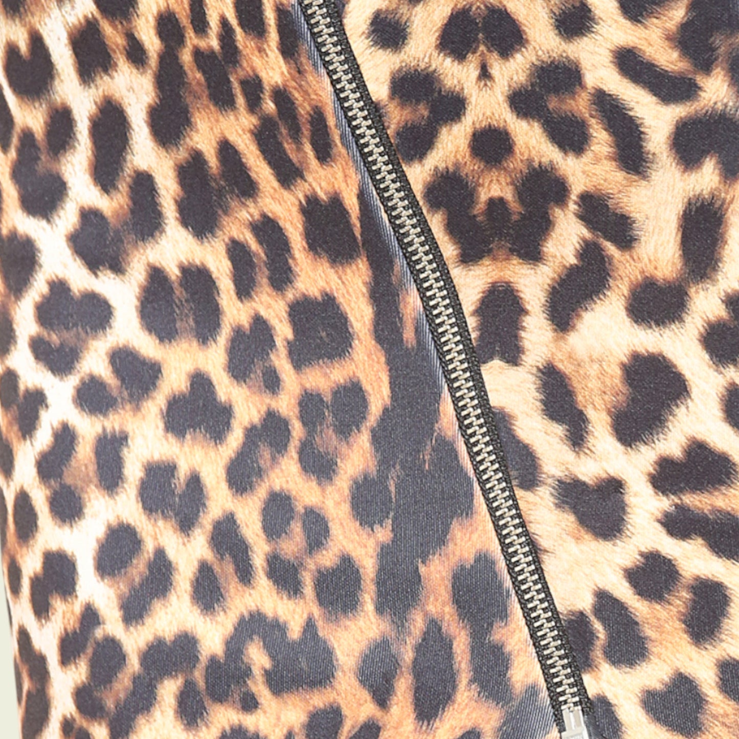 Leopard print fabric with a zipper running vertically.