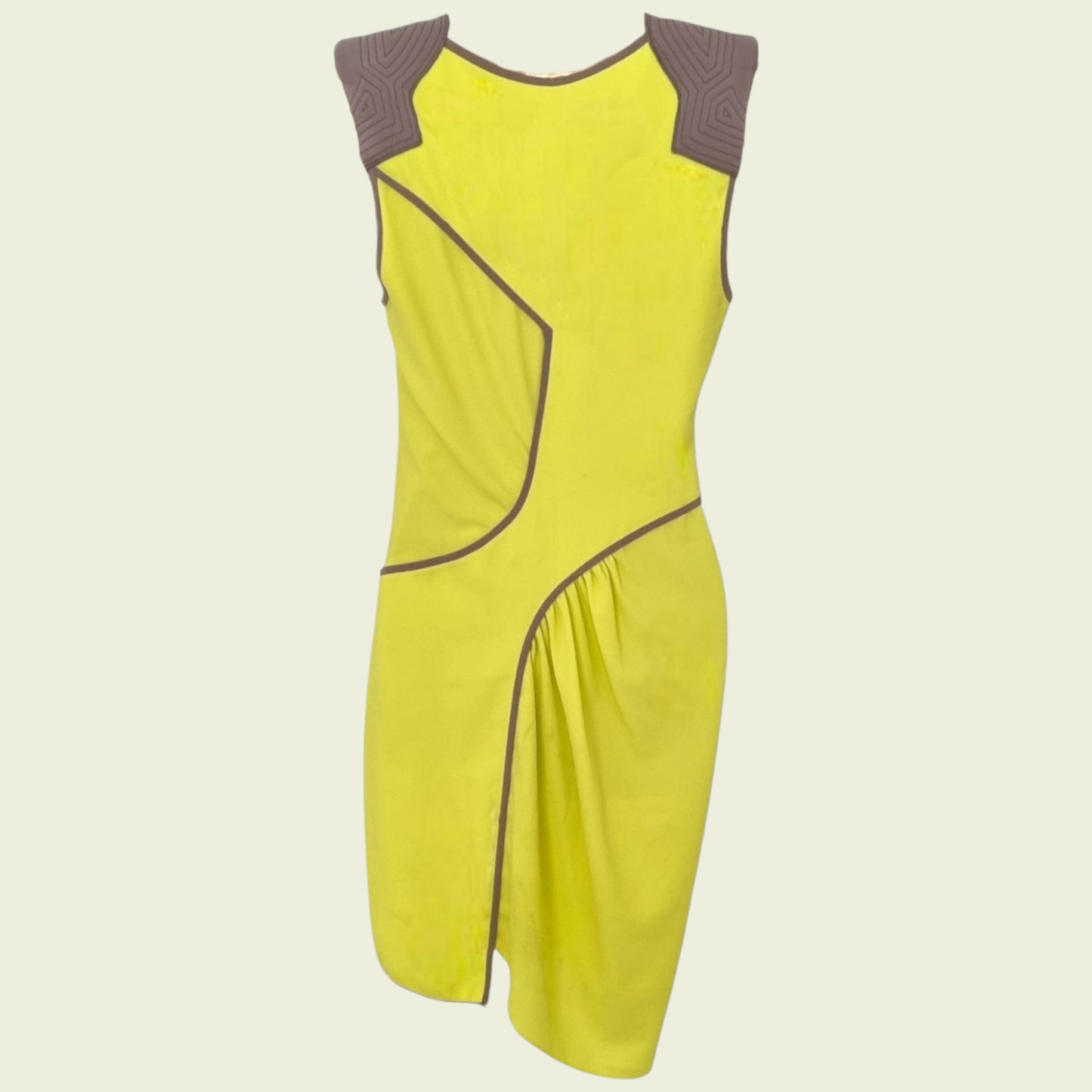 Yellow dress with brown accents on a beige background