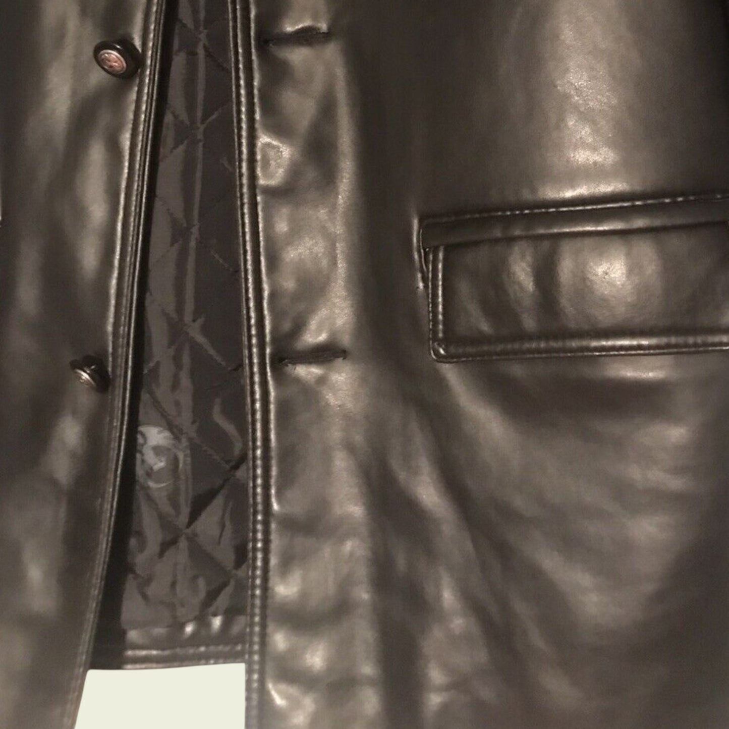 Close-up of a Black leather jacket with quilted lining