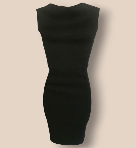 Black dress on a beige background