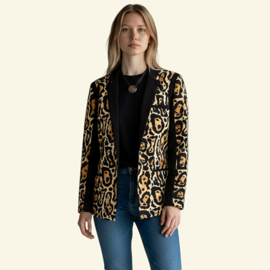 Timelessfashion black polyester jacket with bold leopard print panels and black trim. Open front style.