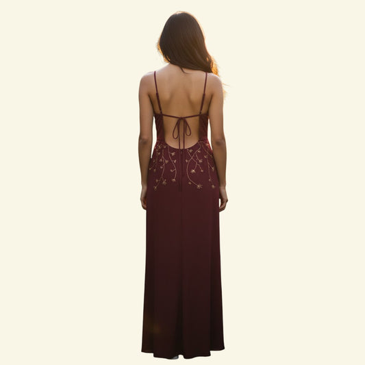 Timelessfashion claret satin maxi skirt with gold beaded waist detail and backless bodice with tie fastening.