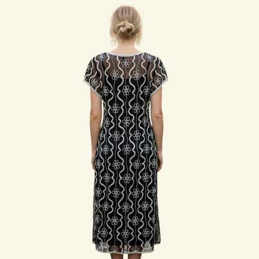 Timelessfashions black midi dress with cream tapework floral and wavy line detailing, cap sleeves.