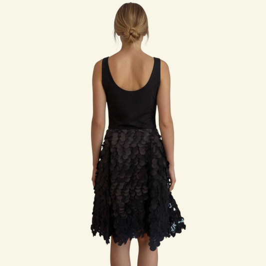 Timelessfashions black fit & flare dress with disc detail, square neckline, and grosgrain textured fabric. Size UK 12.