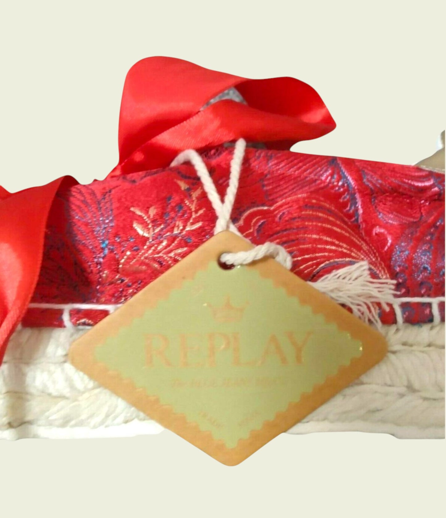 Red fabric with a bow and 'Replay' tag on a white background