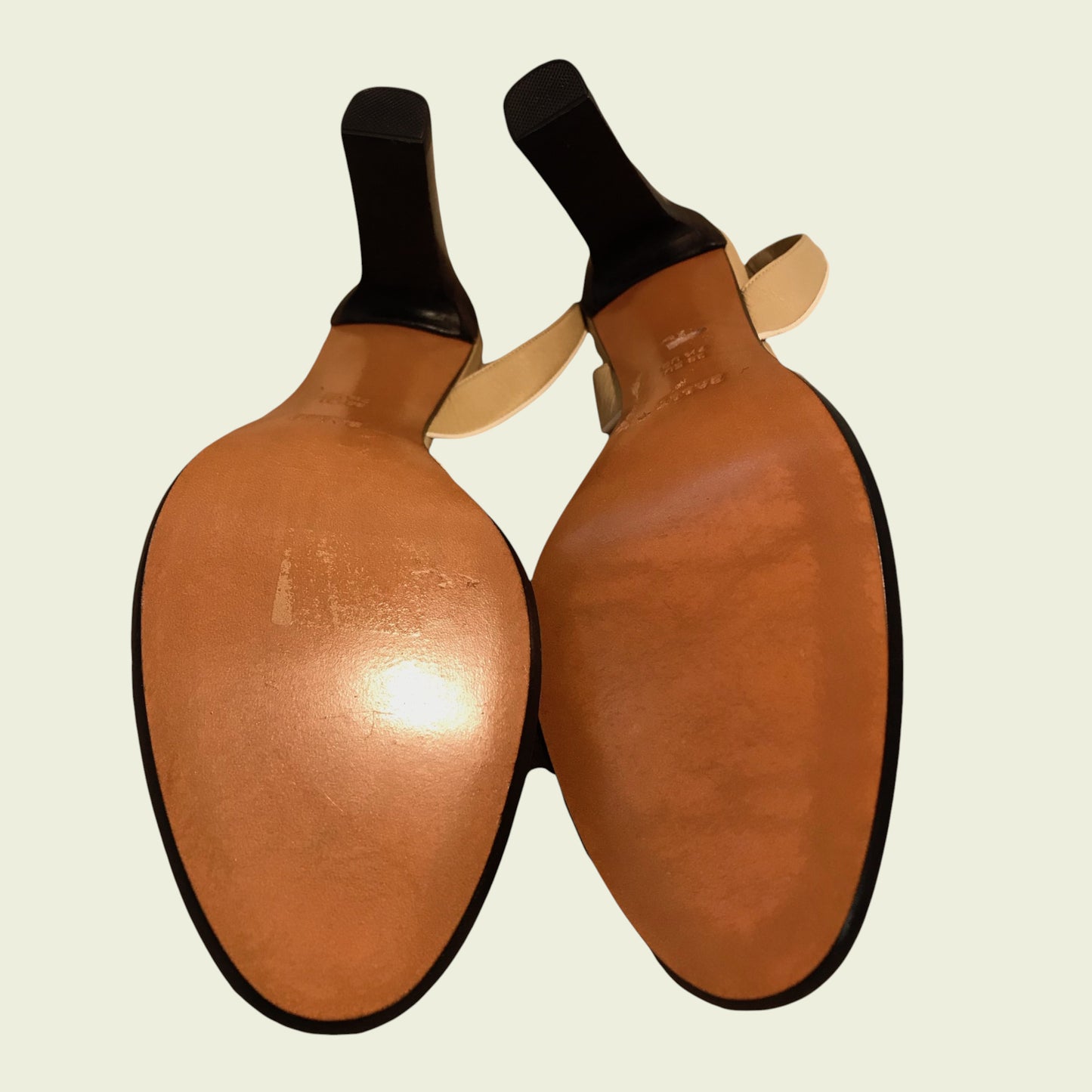 Shoe soles of beige shoes on a beige background