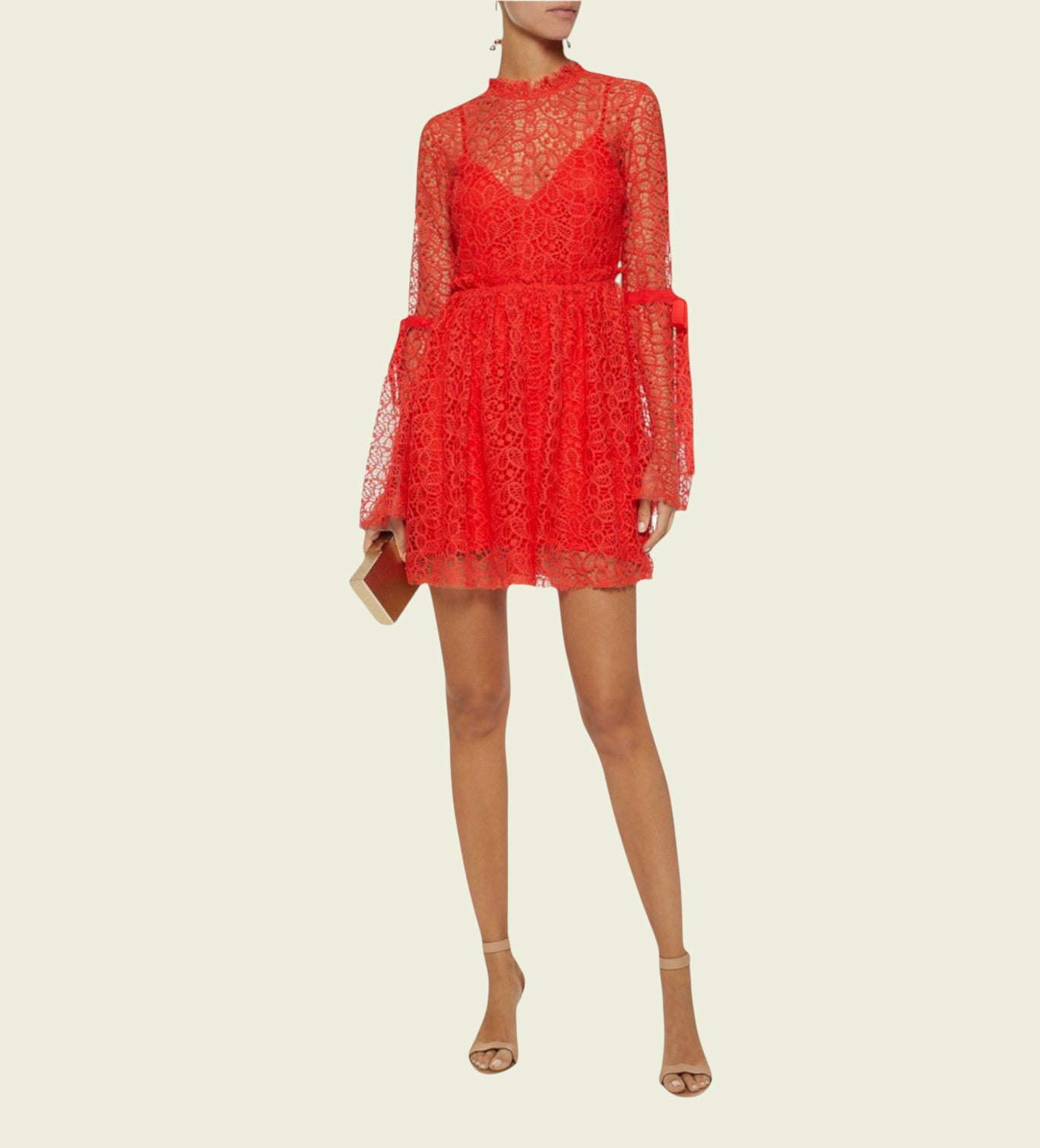 Red lace dress on a beige background