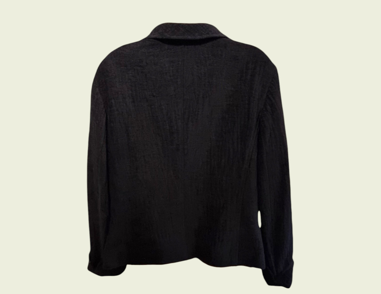Black long-sleeve jacket on a beige background