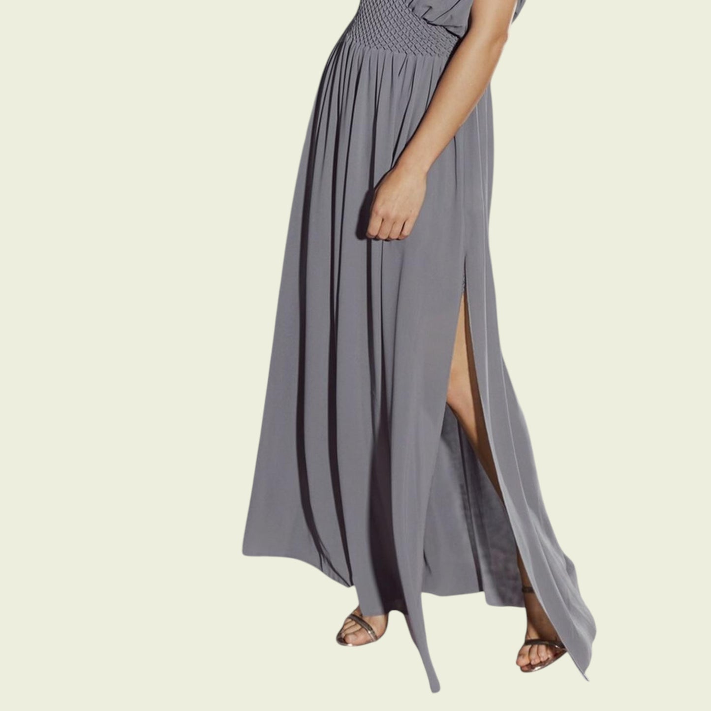 Gray maxi dress with a slit on a beige background