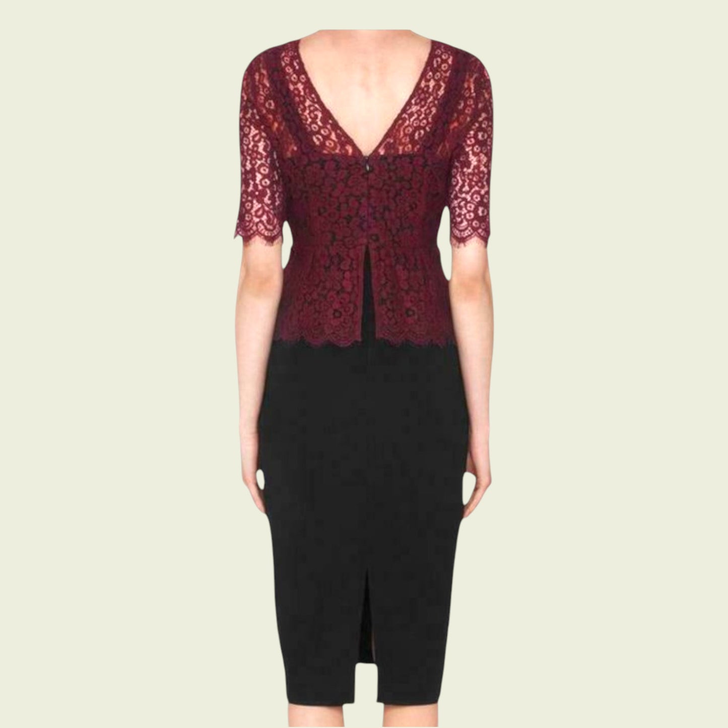 Black dress with red lace detailing on a beige background