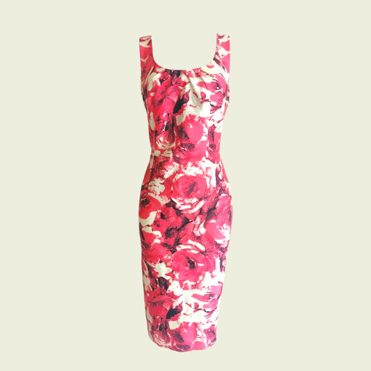 Floral dress with pink and red pattern on a beige background