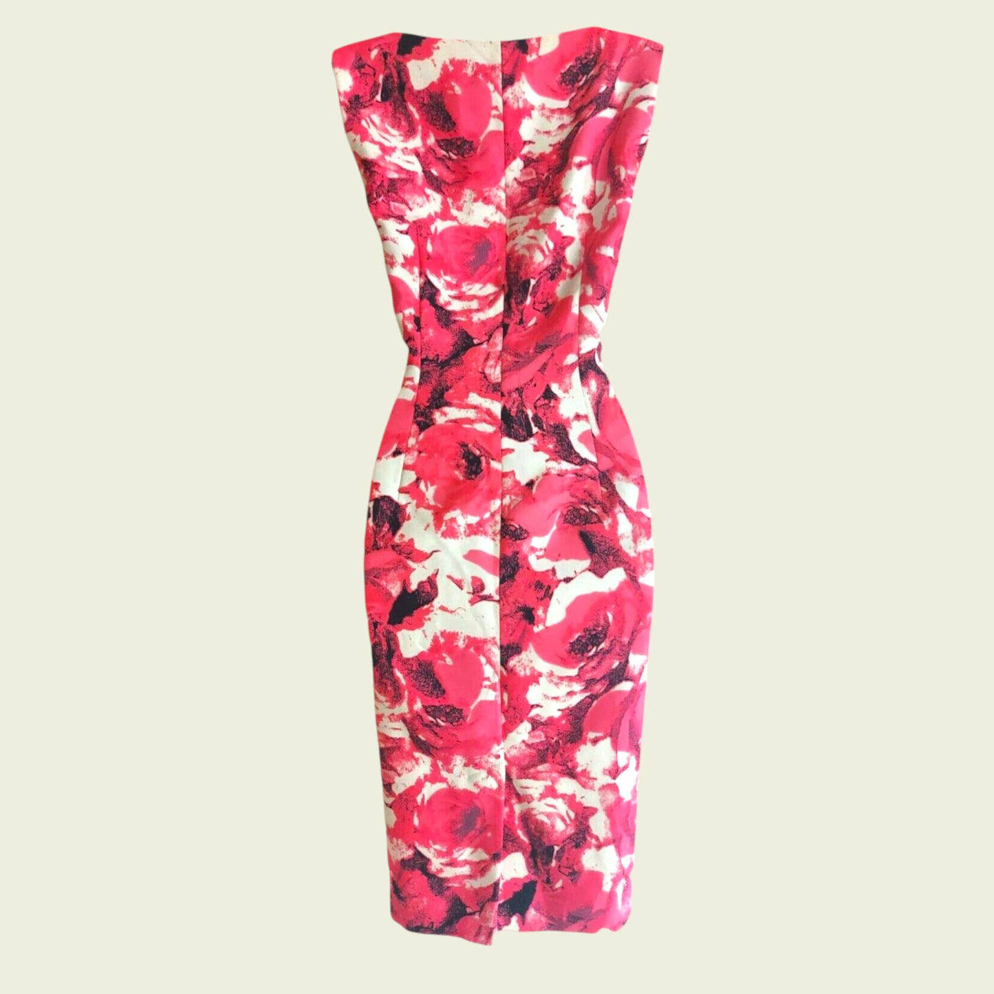 Floral strapless dress with pink, red, and white pattern on a beige background
