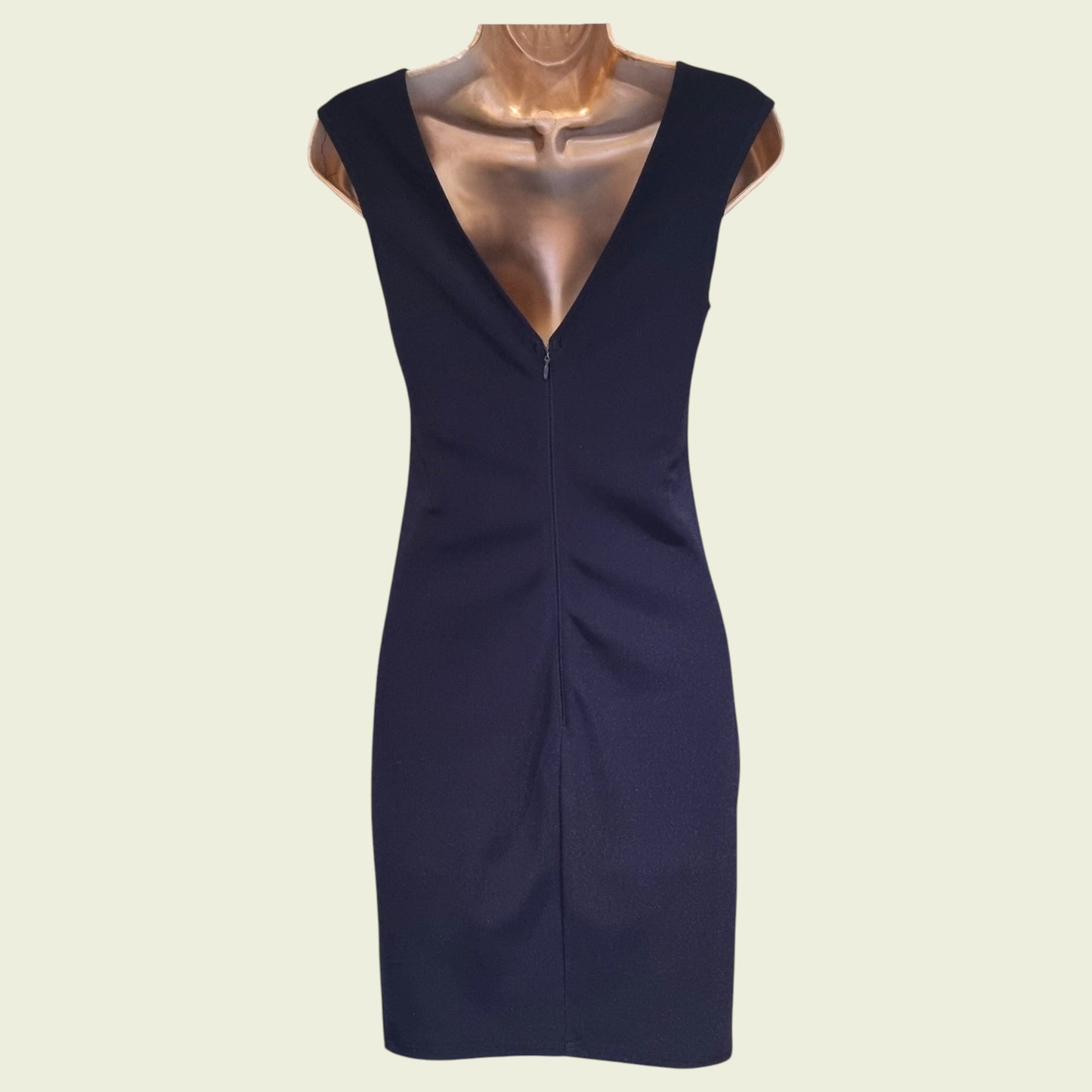 Navy blue dress on a mannequin against a beige background