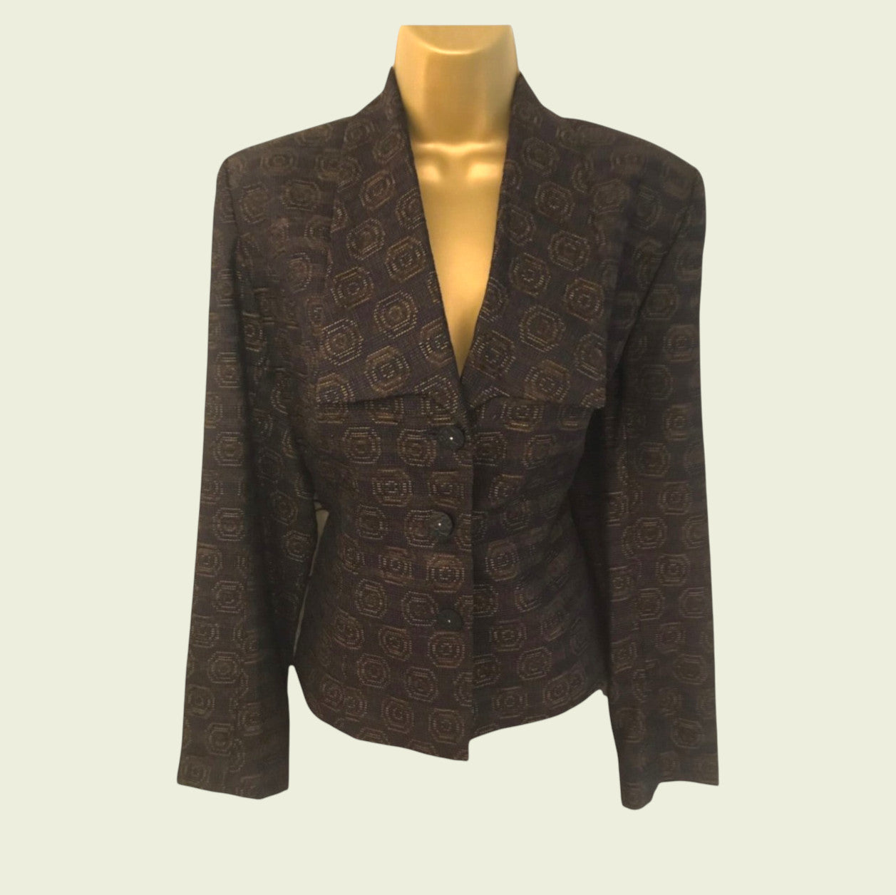 Plum patterned blazer on a mannequin against a light background