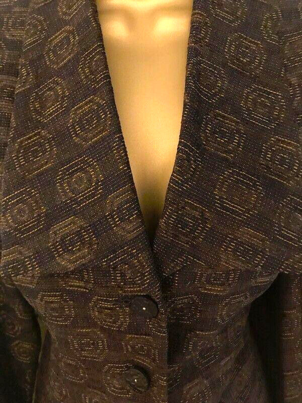 Plum textured blazer on a mannequin with a deep neckline.