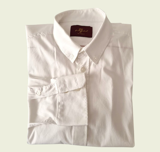 Men's white dress shirt on beige background