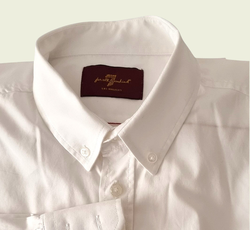 Men's white dress shirt on beige background