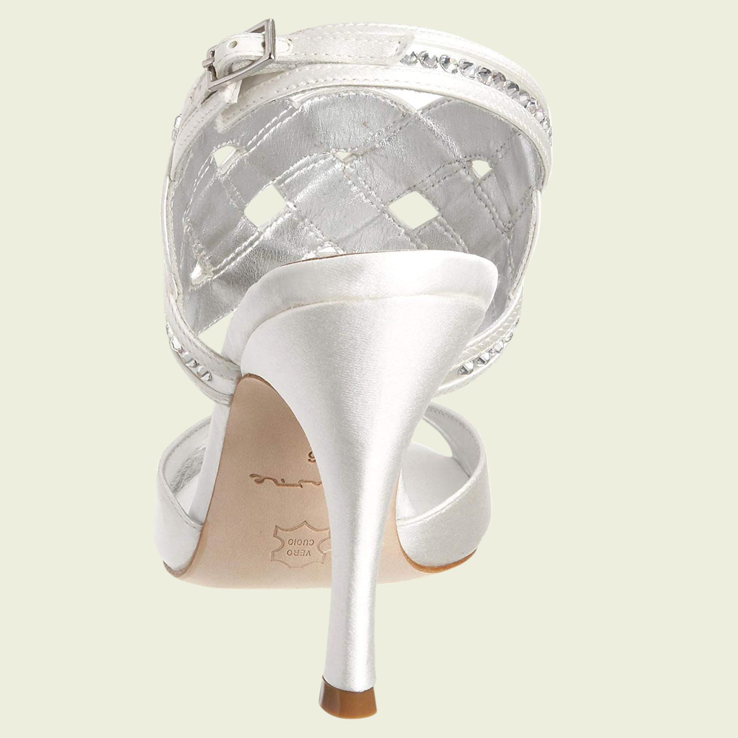 White high-heeled shoe with a clear diamond pattern on a light beige background