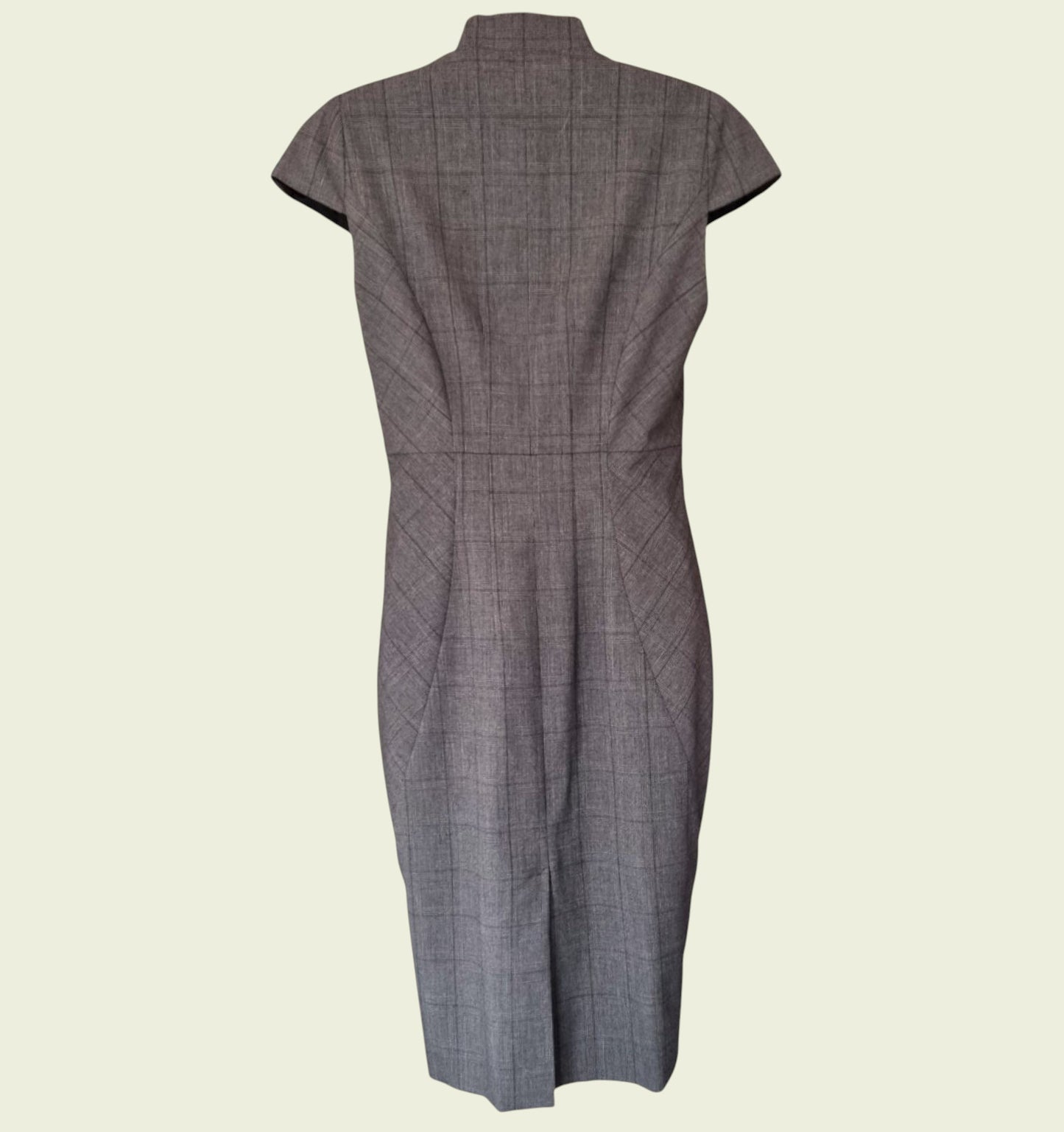 Back view of a gray checkered dress on a beige background