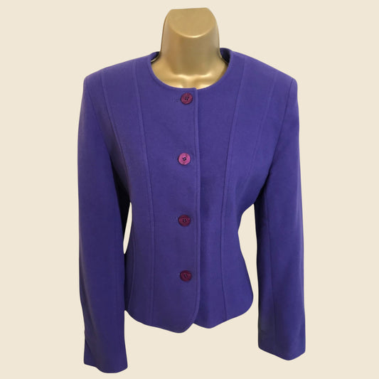 Purple jacket on a mannequin against a beige background