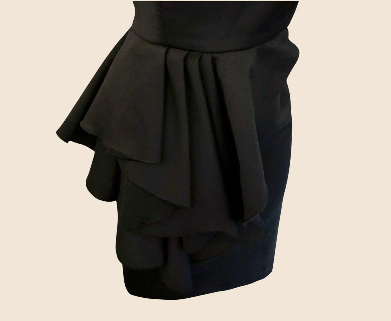 Black layered skirt on a beige background