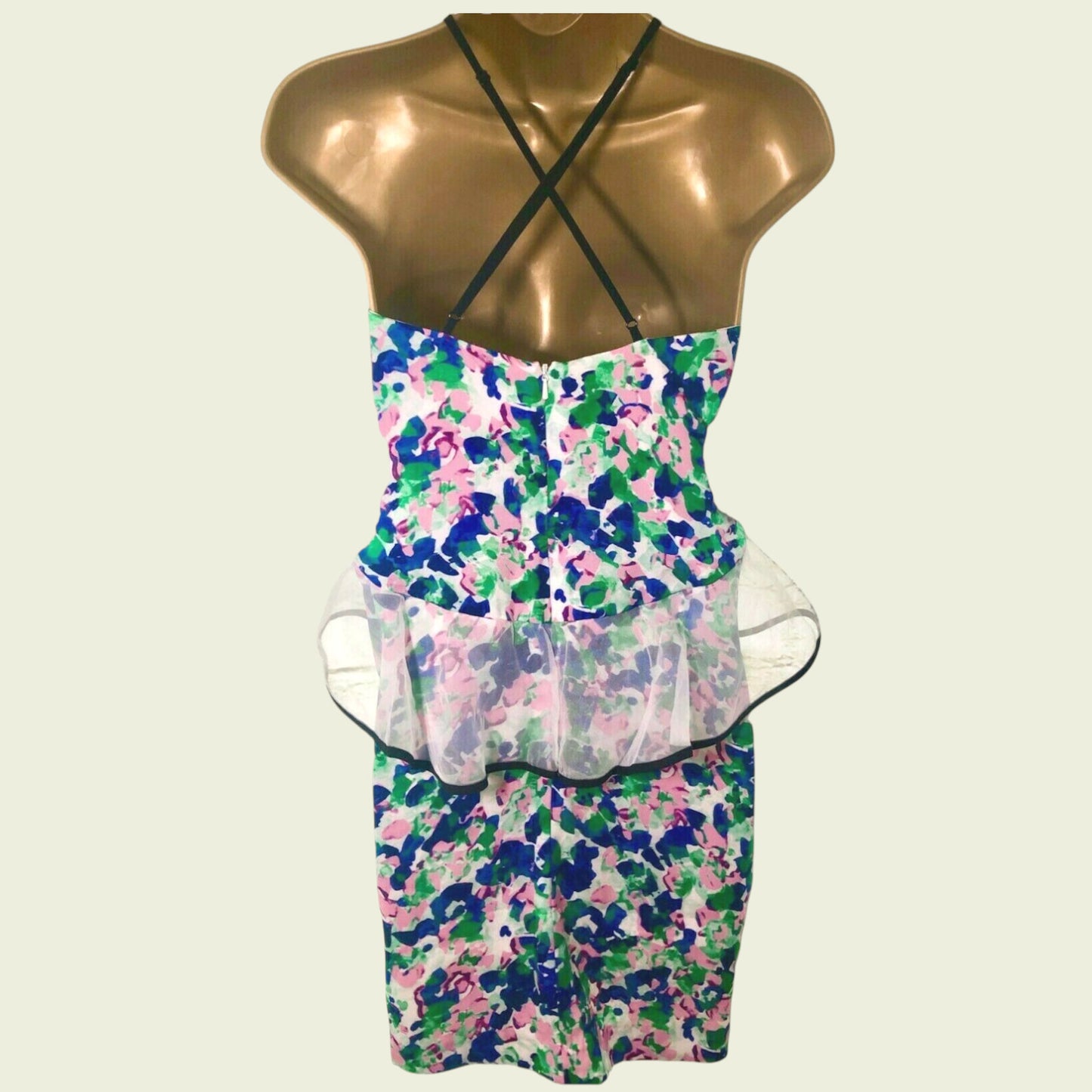 Floral dress on a mannequin with a white background