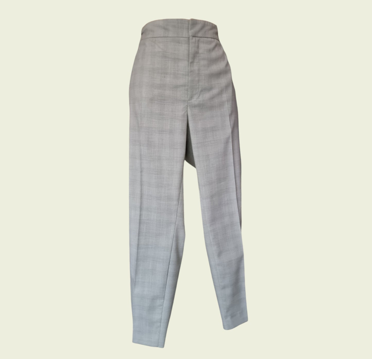 Mint green checkered pants on a beige background