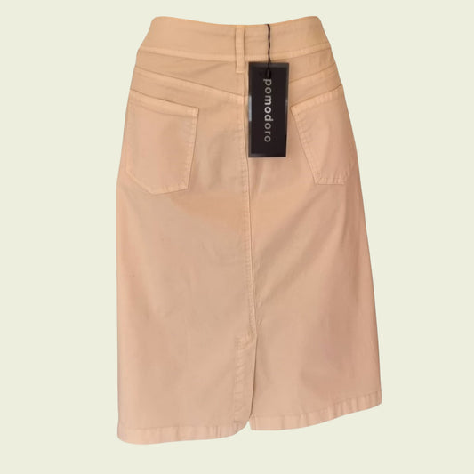 Stone skirt with a tag on a beige background