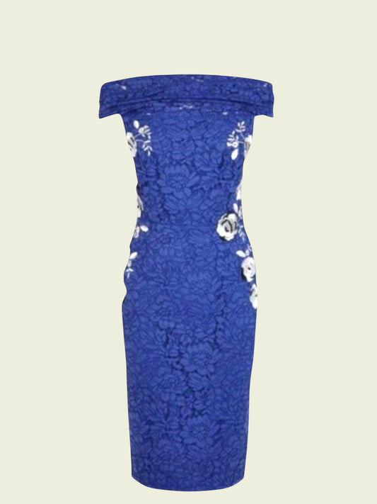 Blue lace dress with floral embellishments on a beige background