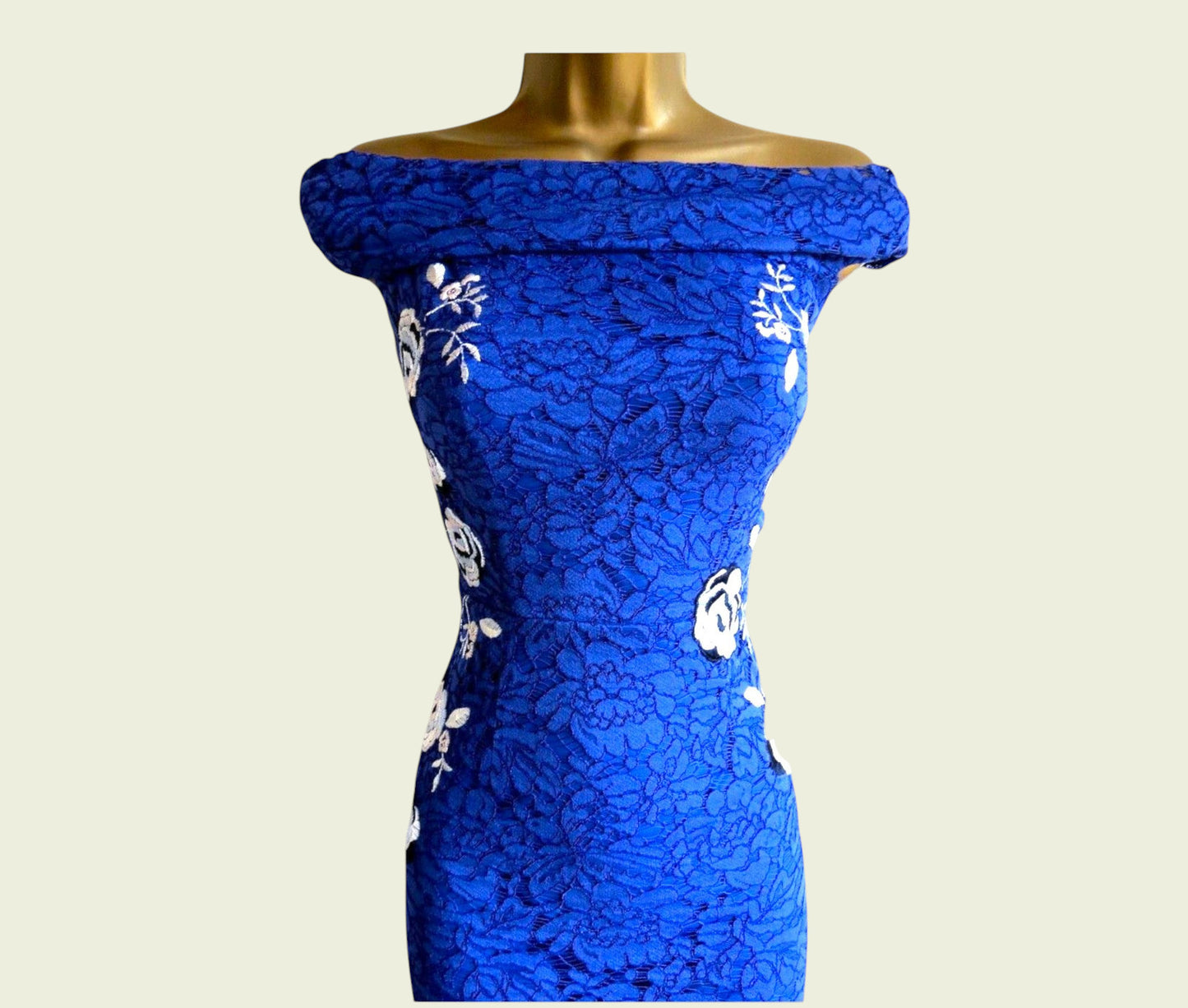Blue lace dress on a mannequin against a white background