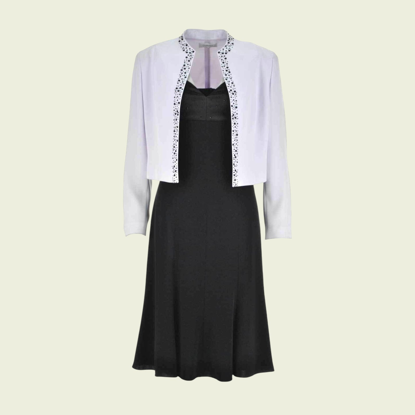 Llilac jacket and a black dress on a light beige background