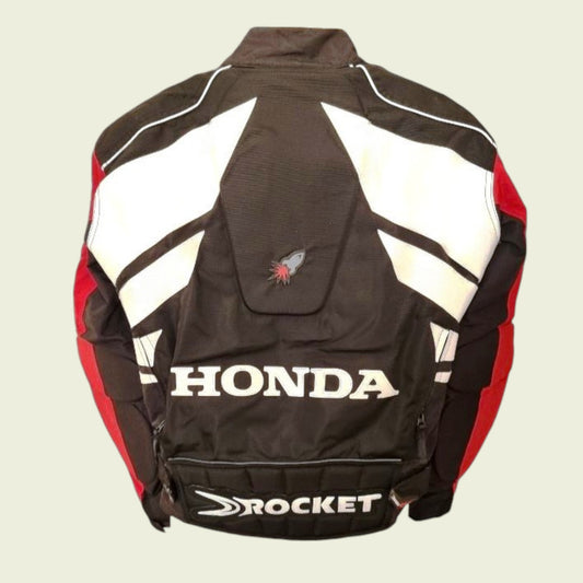 Black, red, and white motorcycle jacket with Honda branding on a beige background