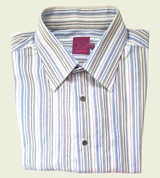 Folded striped shirt with a brand label on a light background