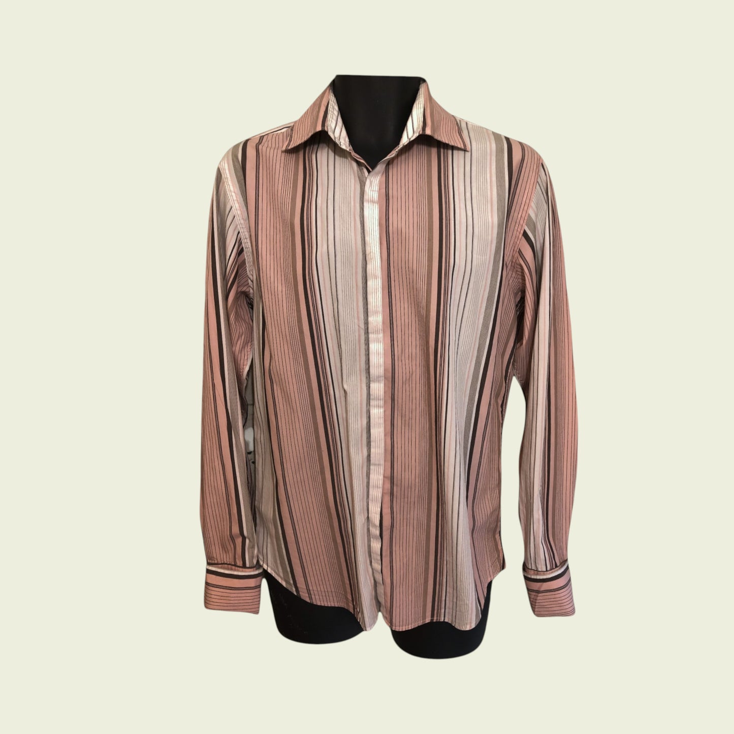 Striped shirt on a mannequin against a beige background
