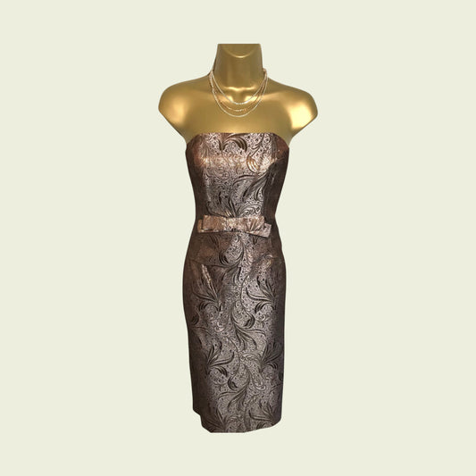 Decorative strapless dress on a mannequin with a beige background