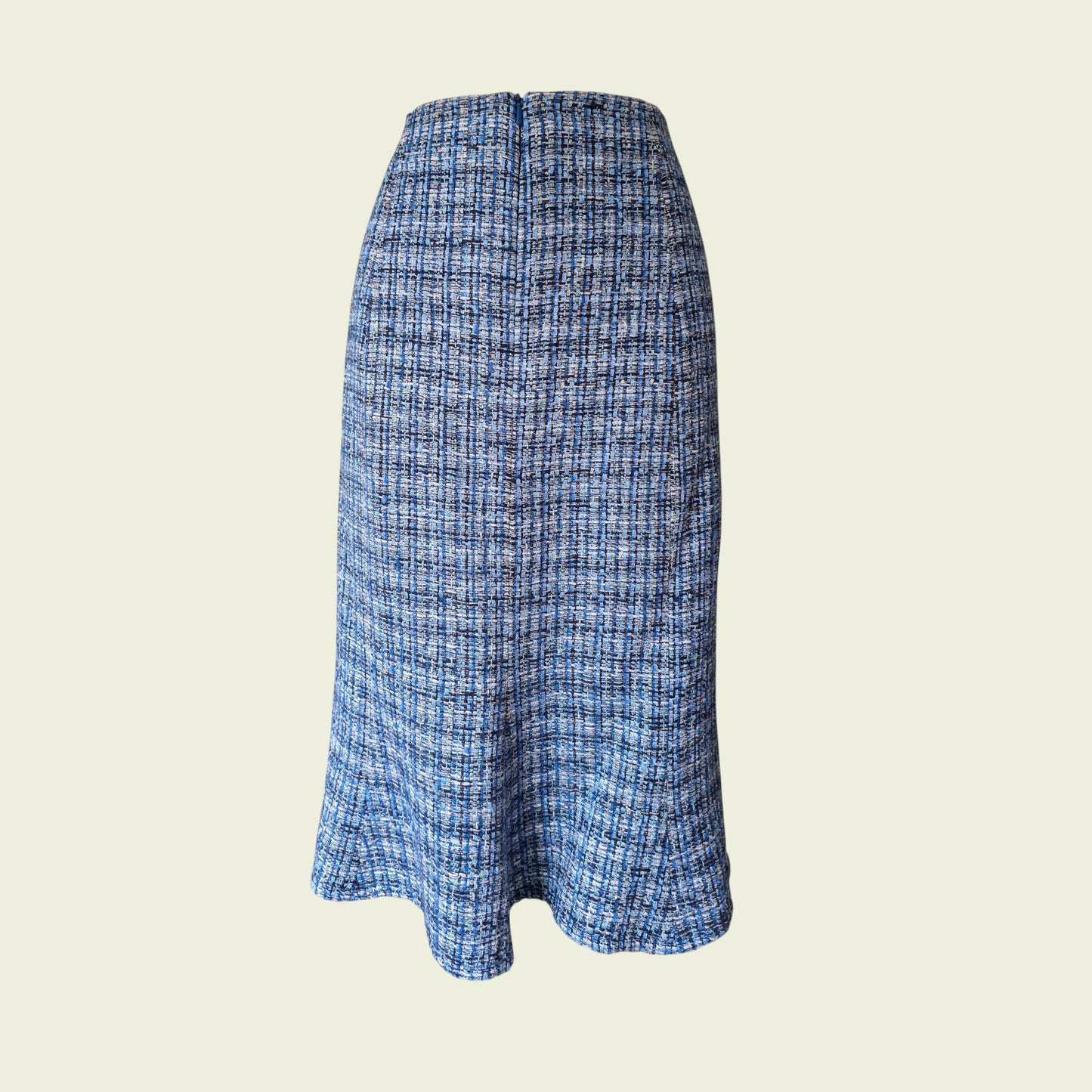 Blue checkered skirt on a beige background