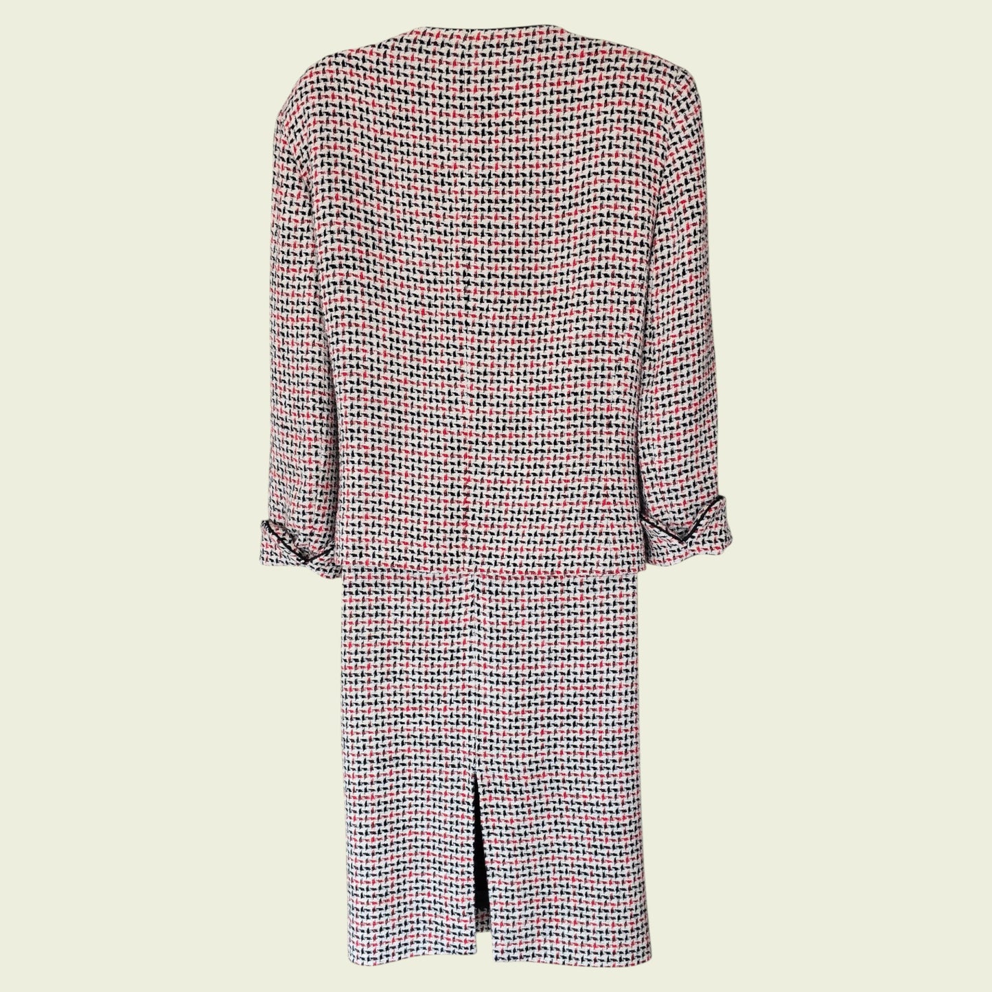 Houndstooth patterned suit on a beige background