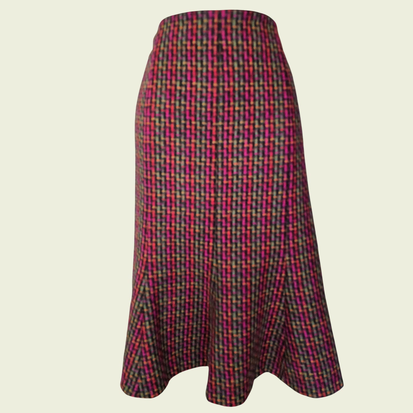Plaid skirt with multicolor pattern on a beige background