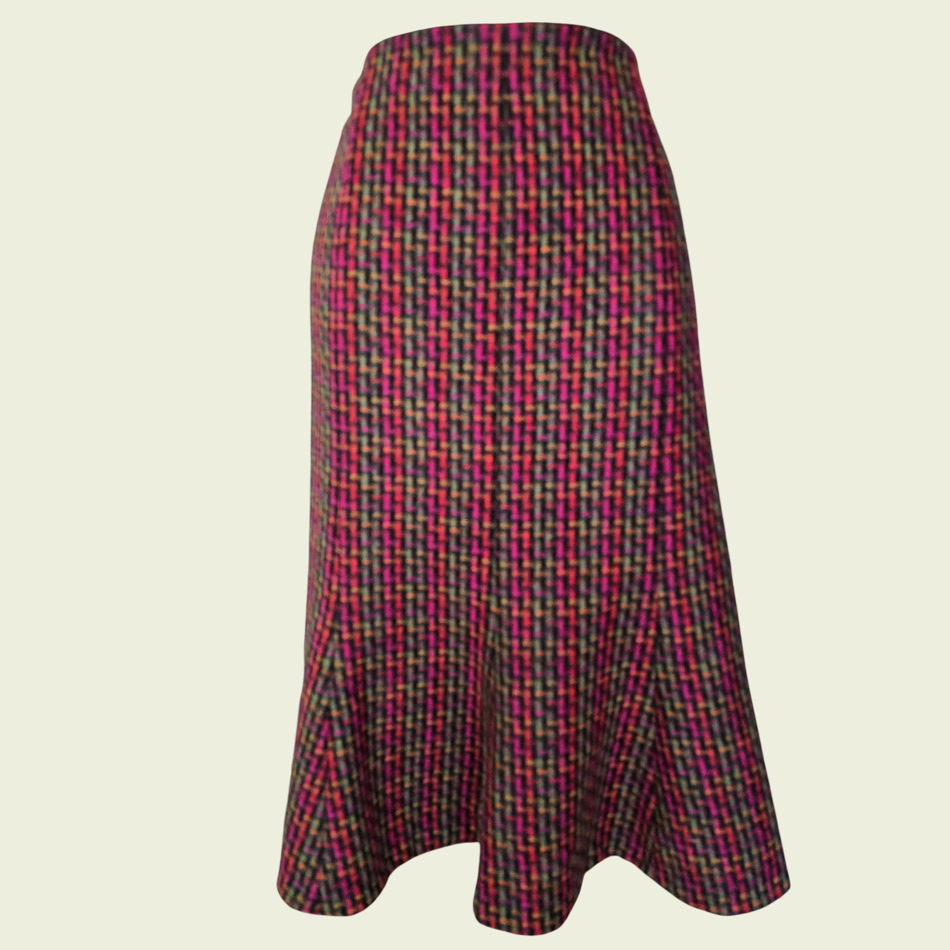 Plaid skirt with multicolor pattern on a beige background