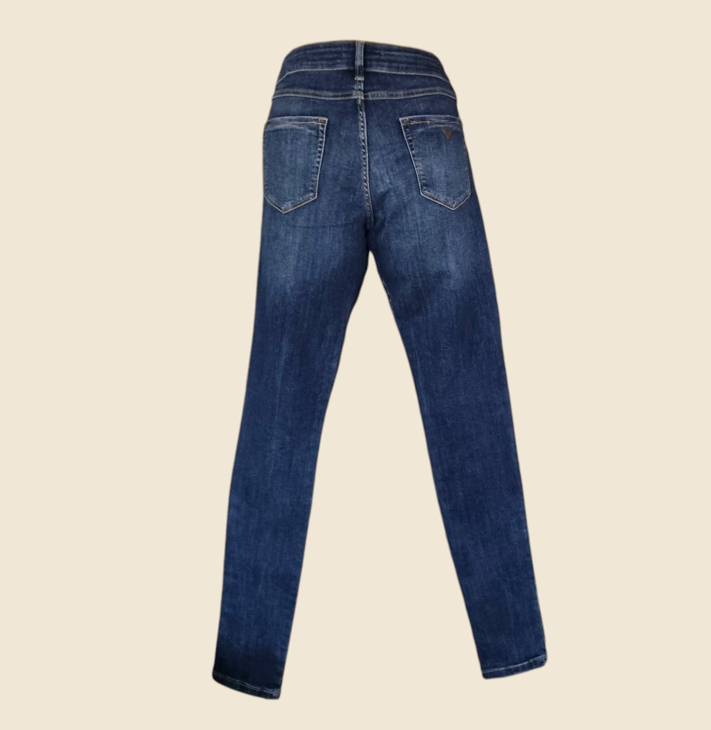 Blue jeans on a beige background